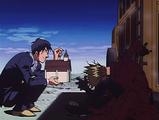 Wolfwood urges Vash to try the portable confessional.