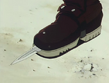 Vash reveals his boot's hidden knife.