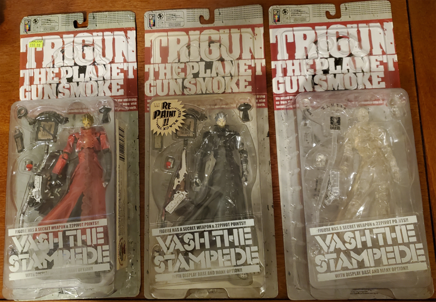 L-R: Original release Vash (no glasses), Sinister Black version (no glasses), Crystal Clear version (glasses)